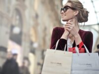 Stylish woman with shopping bags in Galleria Vittorio Emanuele II, Milan.
